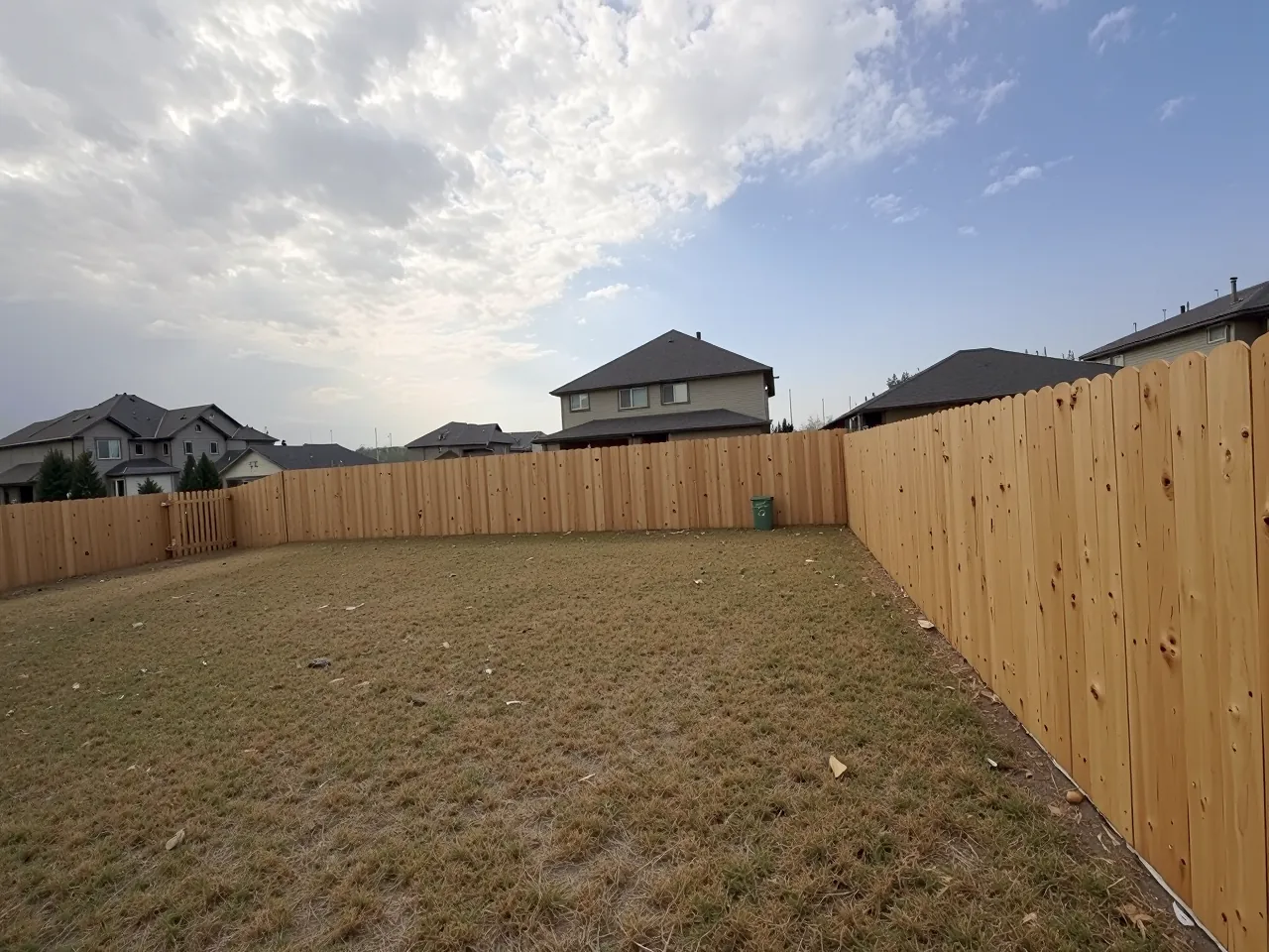 Newly fenced backyard with a tall cedar privacy fence in Houston, TX